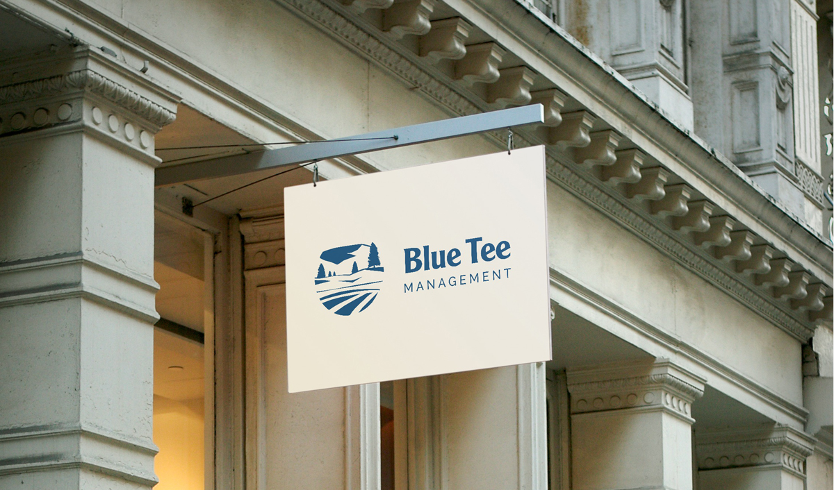 Blue Tee Management Logo on Sign